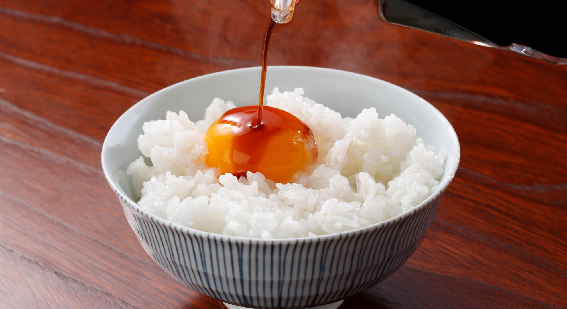 Enjoy raw egg over hot rice.